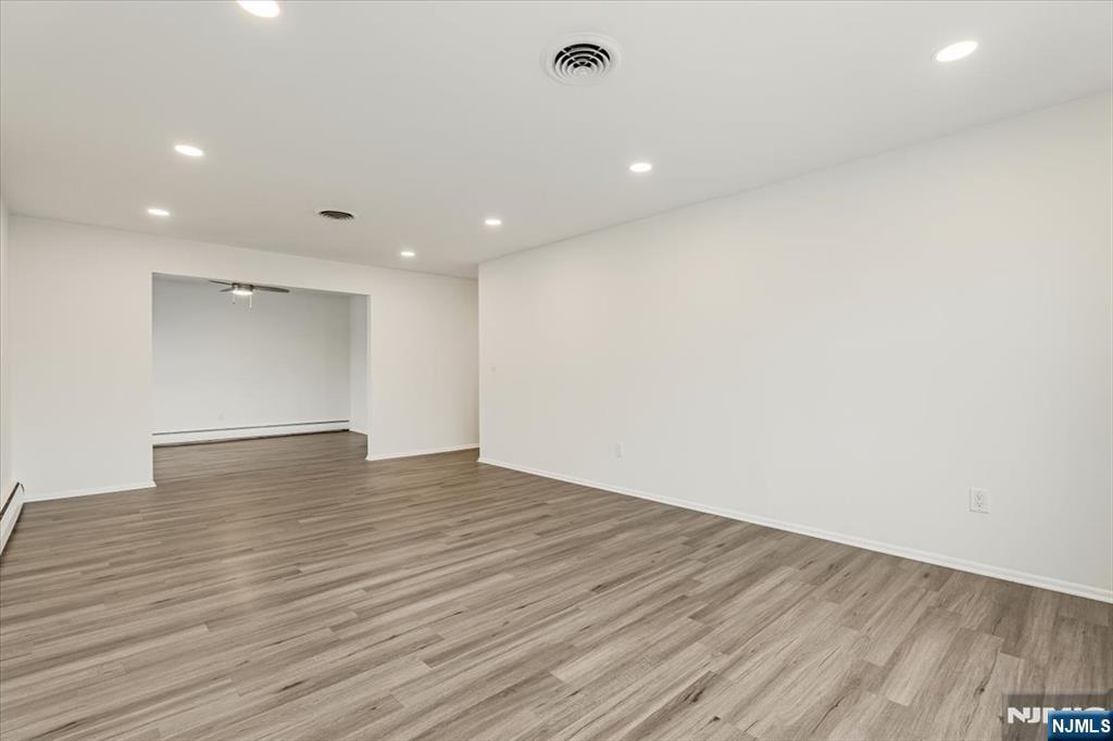 35 Field Road, Unit 2 Maplewood, NJ 07040 - Photo 3 of 13 a view of empty room with wooden floor
