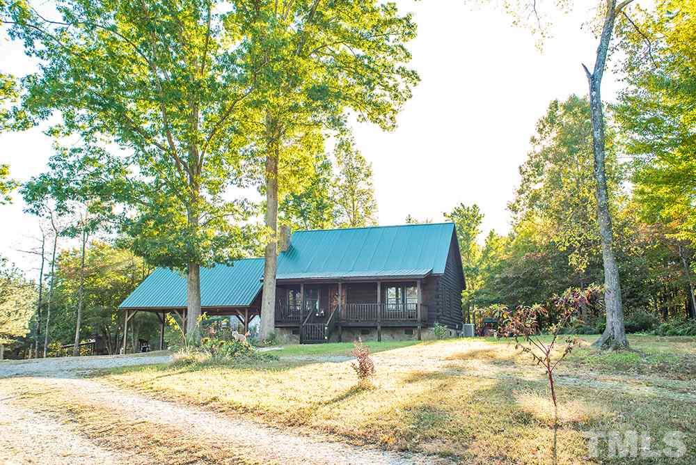 3520 Bowmantown Road Roxboro, NC 27574 - Photo 2 of 24 a house with trees in the background