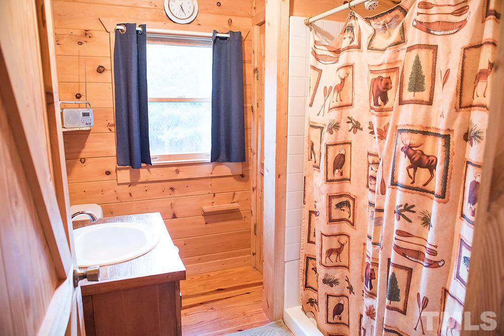 3520 Bowmantown Road Roxboro, NC 27574 - Photo 23 of 24 view of bathroom with tub and window