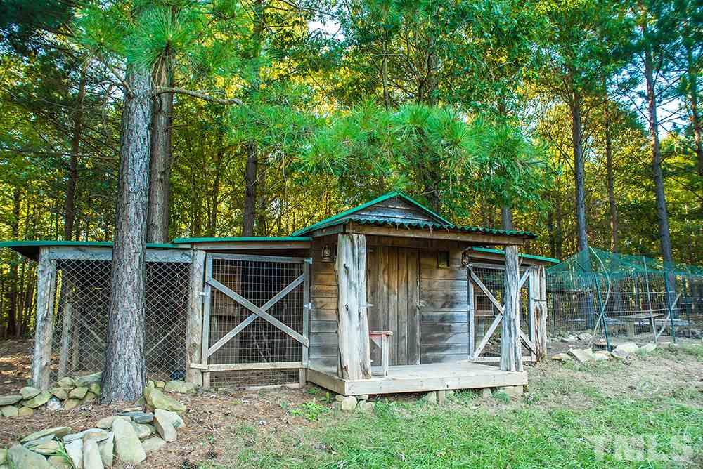 3520 Bowmantown Road Roxboro, NC 27574 - Photo 10 of 24 an outdoor space with wooden fence and deck