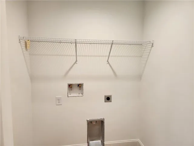 a bathroom with a shower and a window