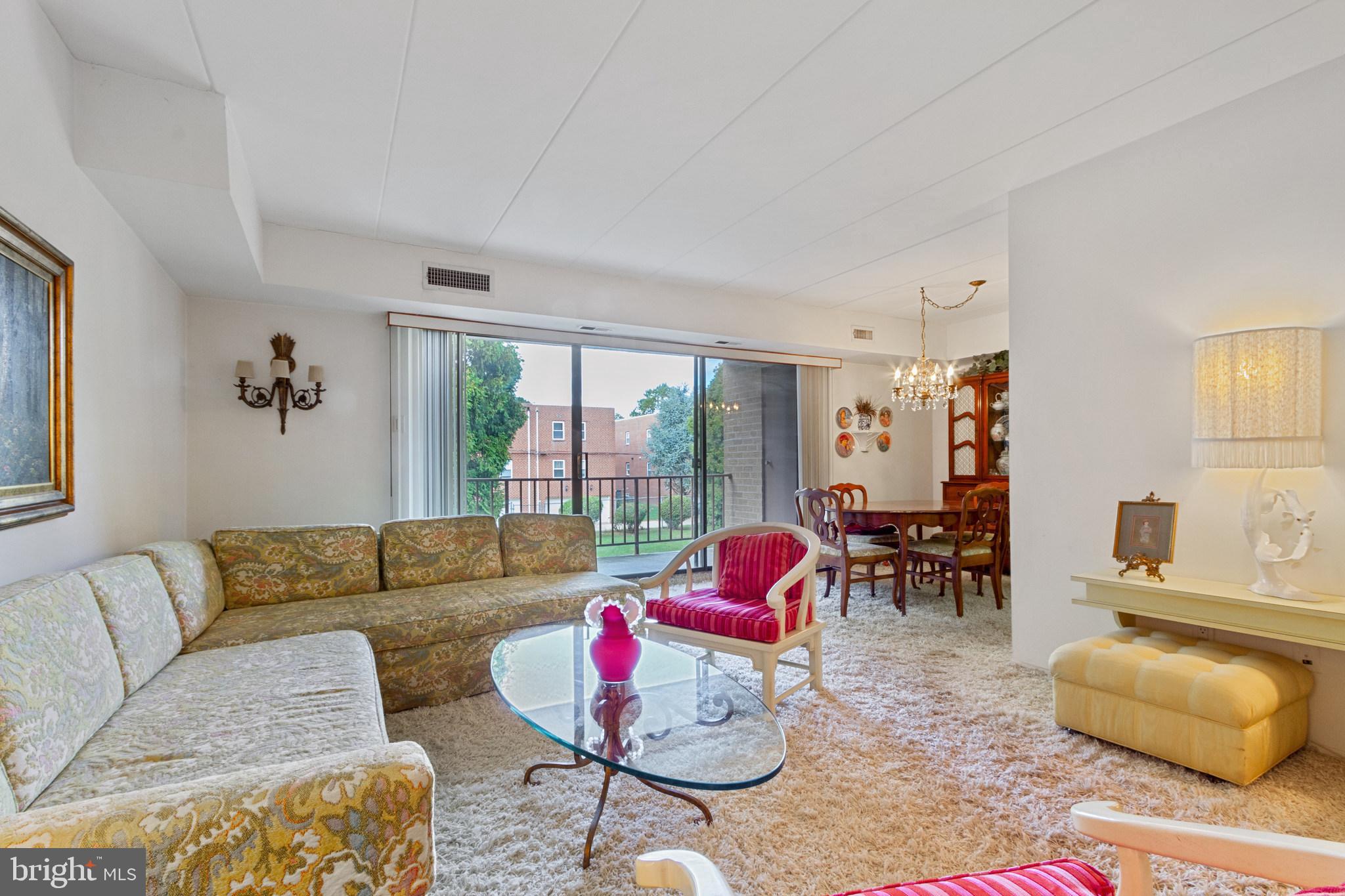 8922 Krewstown Road, Unit 203 Philadelphia, PA 19115 - Photo 6 of 14 Living room over looks courtyard