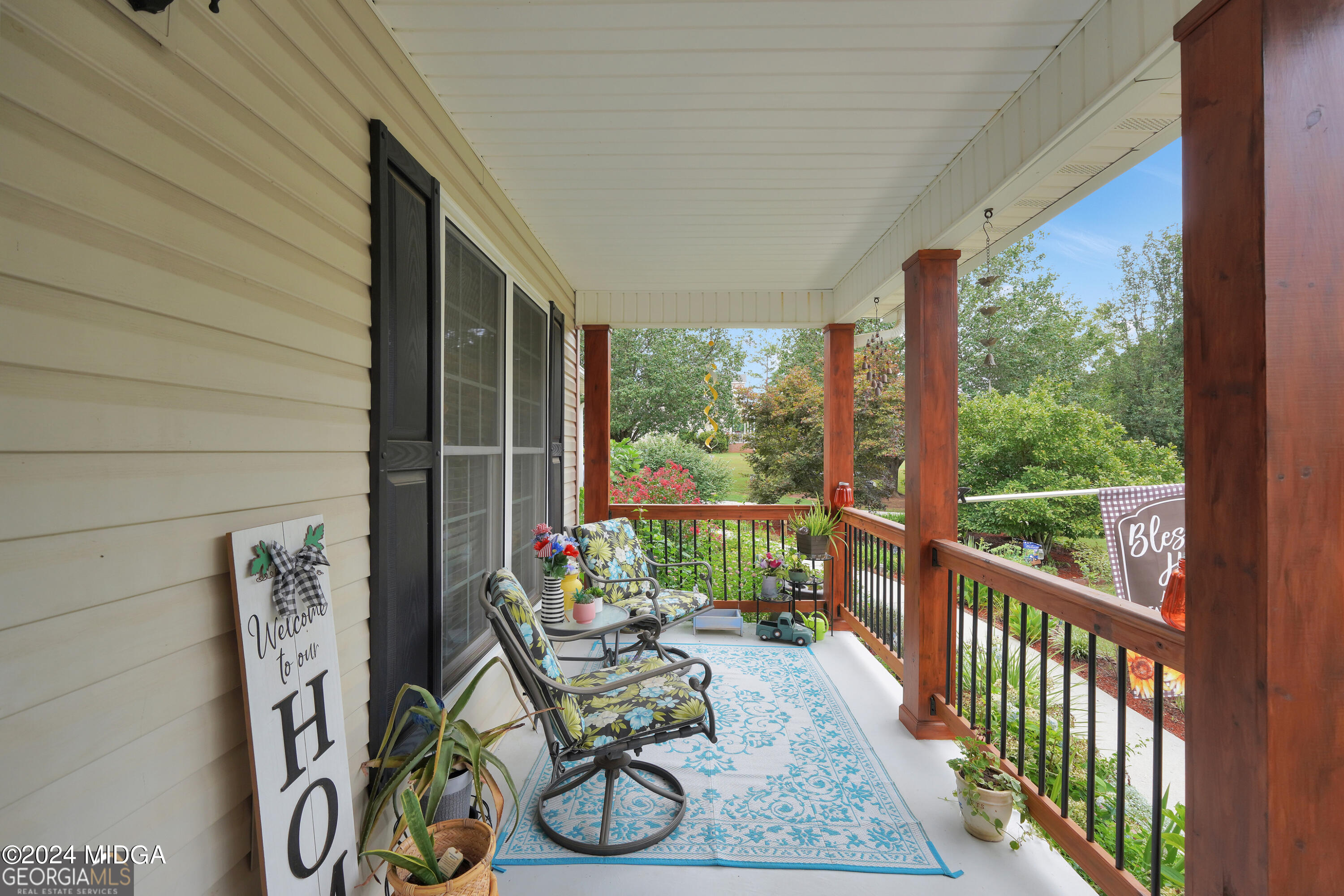 208 Brown Branch Road Locust Grove, GA 30248 - Photo 11 of 44 a balcony with furniture and wooden floor