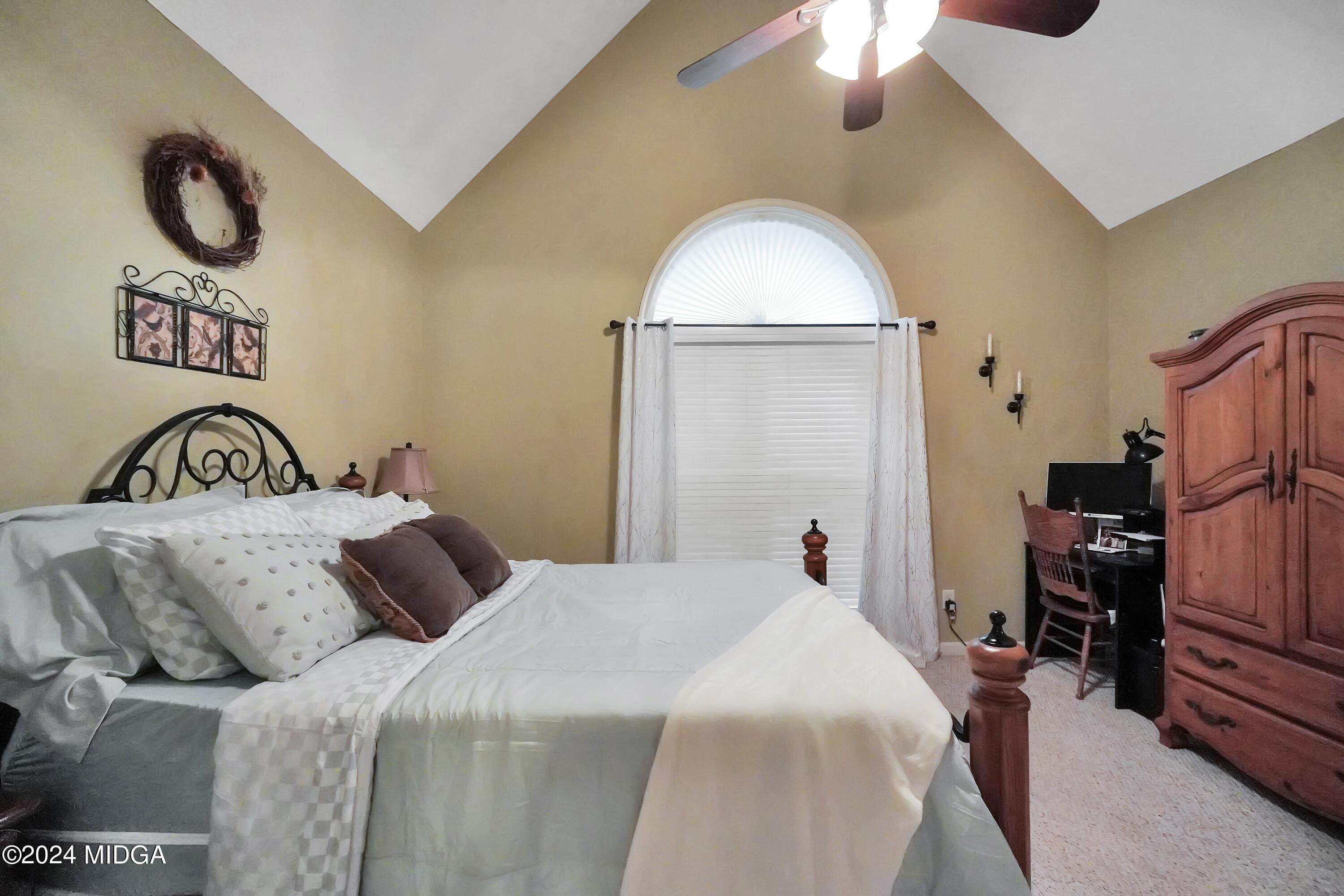 208 Brown Branch Road Locust Grove, GA 30248 - Photo 17 of 44 a bedroom with a bed and a chandelier