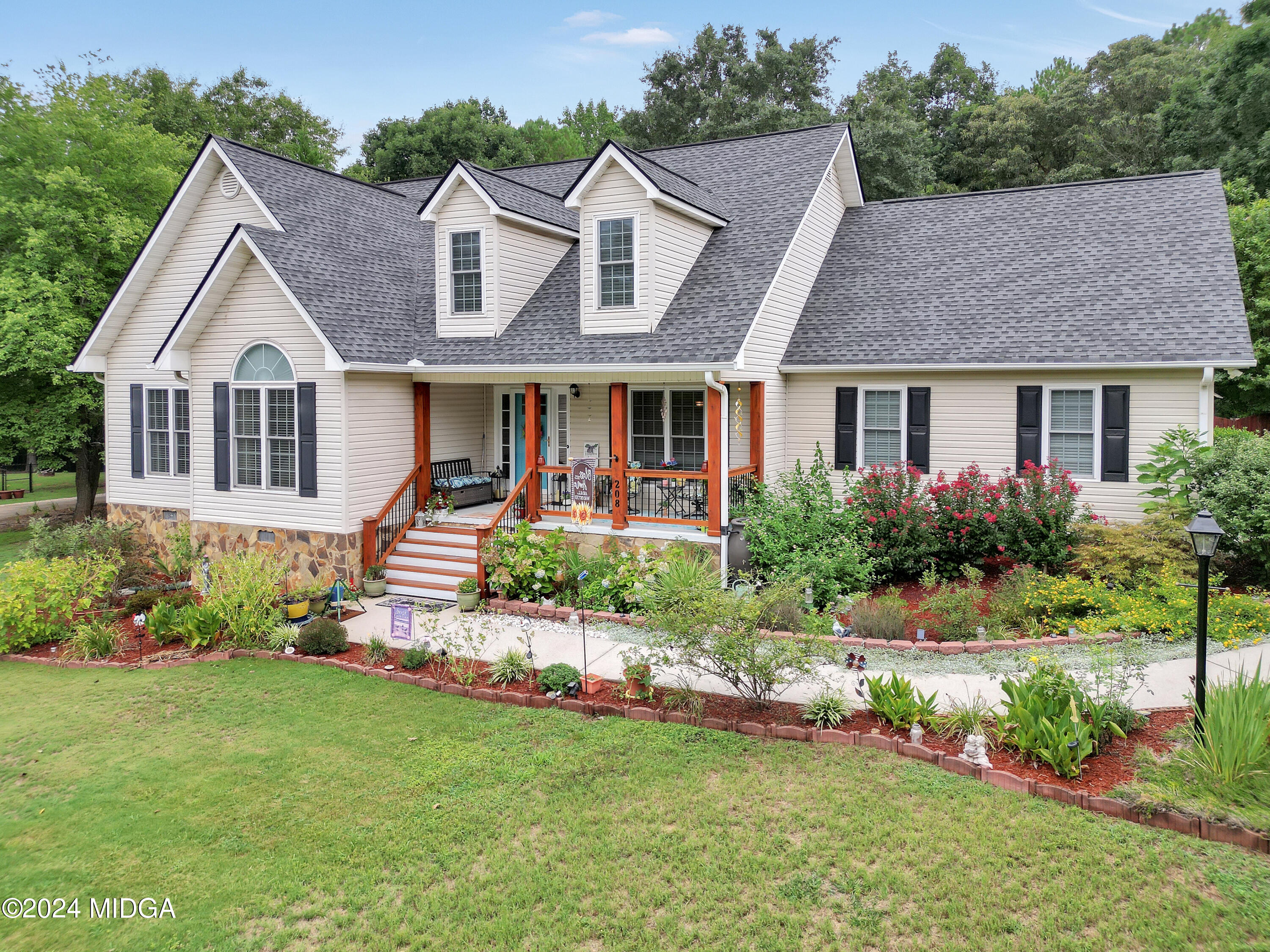 208 Brown Branch Road Locust Grove, GA 30248 - Photo 2 of 44 a front view of house with yard and green space