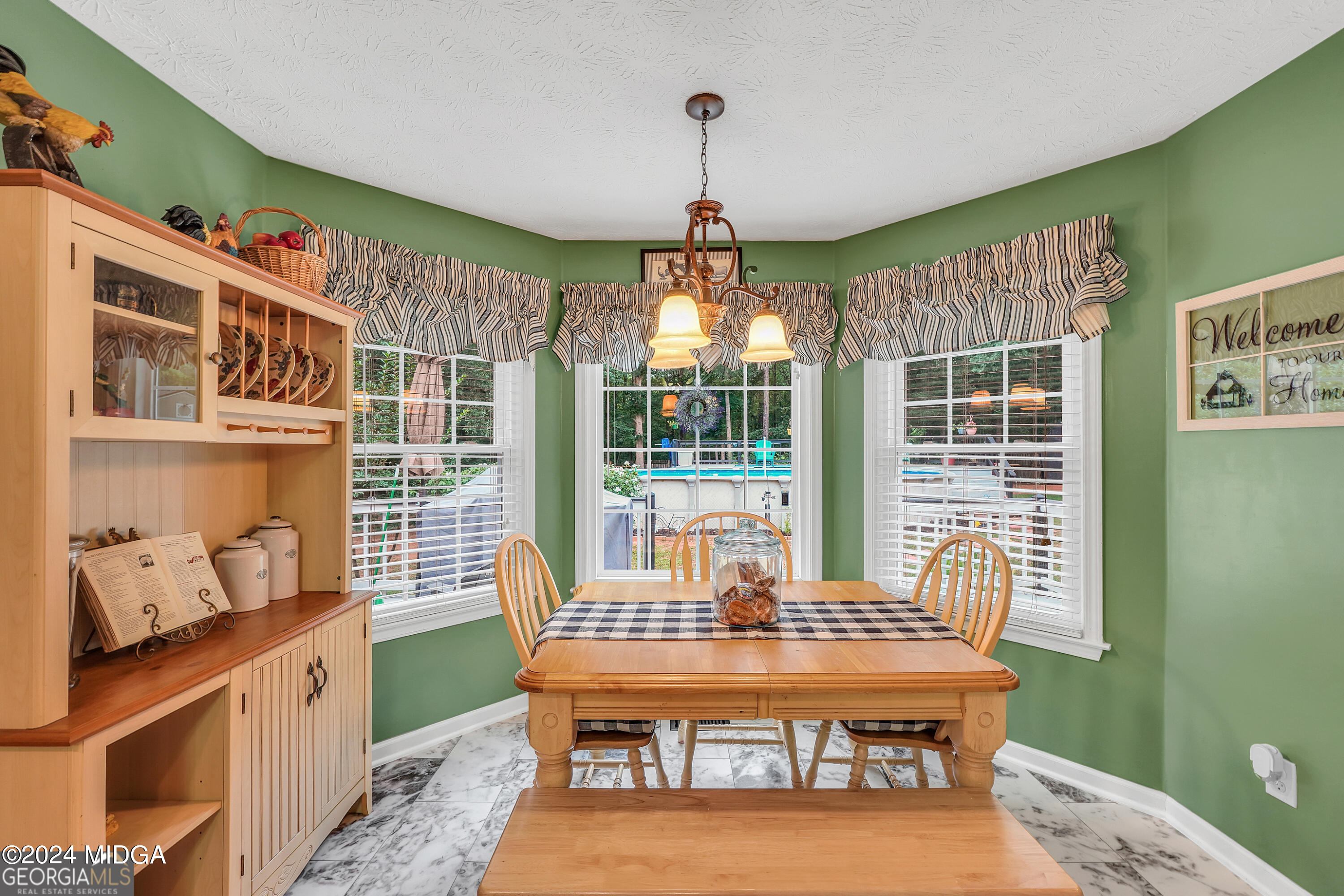 208 Brown Branch Road Locust Grove, GA 30248 - Photo 25 of 44 a dining room with a window and furniture