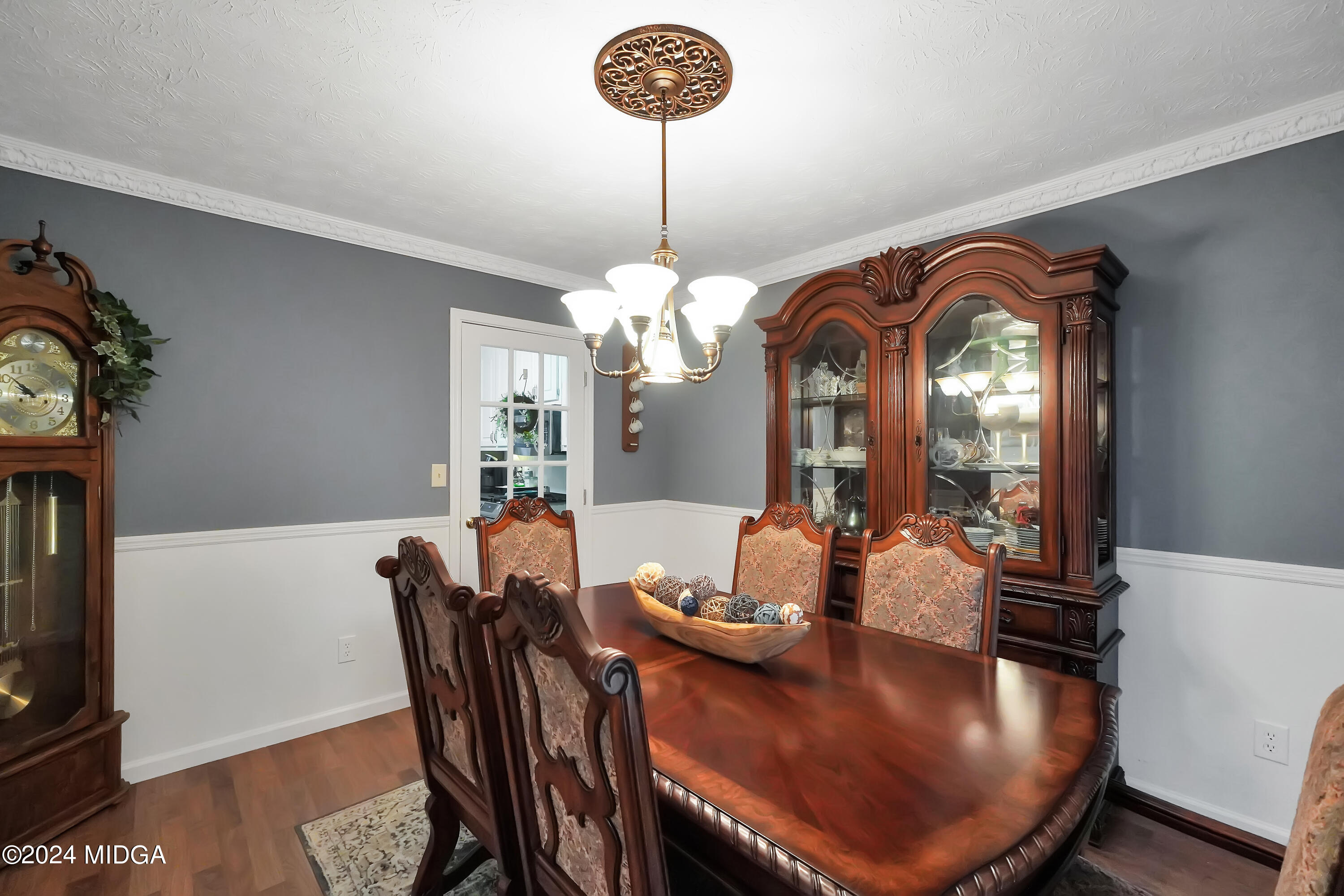 208 Brown Branch Road Locust Grove, GA 30248 - Photo 27 of 44 a dining room with furniture a chandelier and window