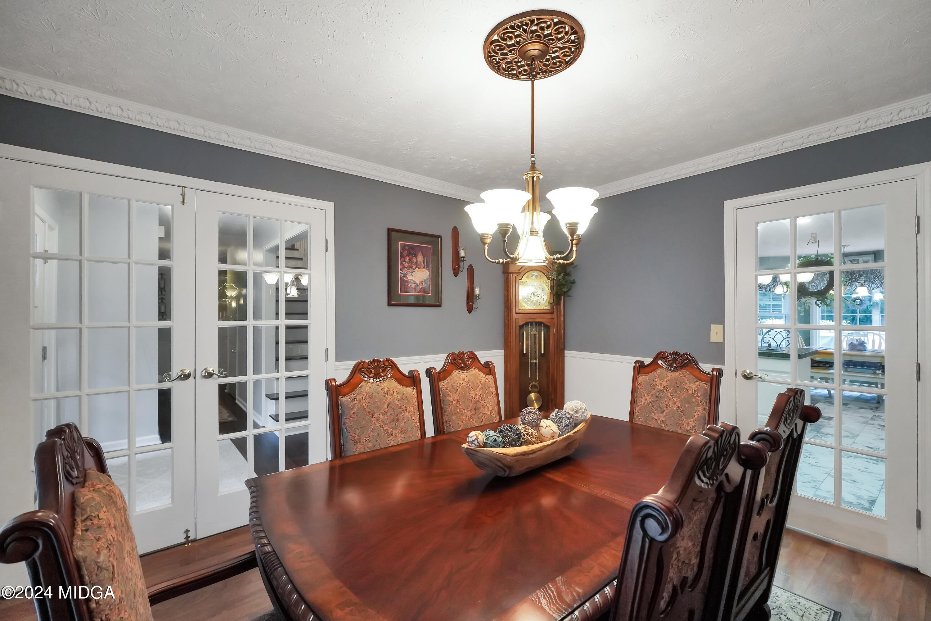 208 Brown Branch Road Locust Grove, GA 30248 - Photo 28 of 44 a view of a dining room with furniture a chandelier and wooden floor