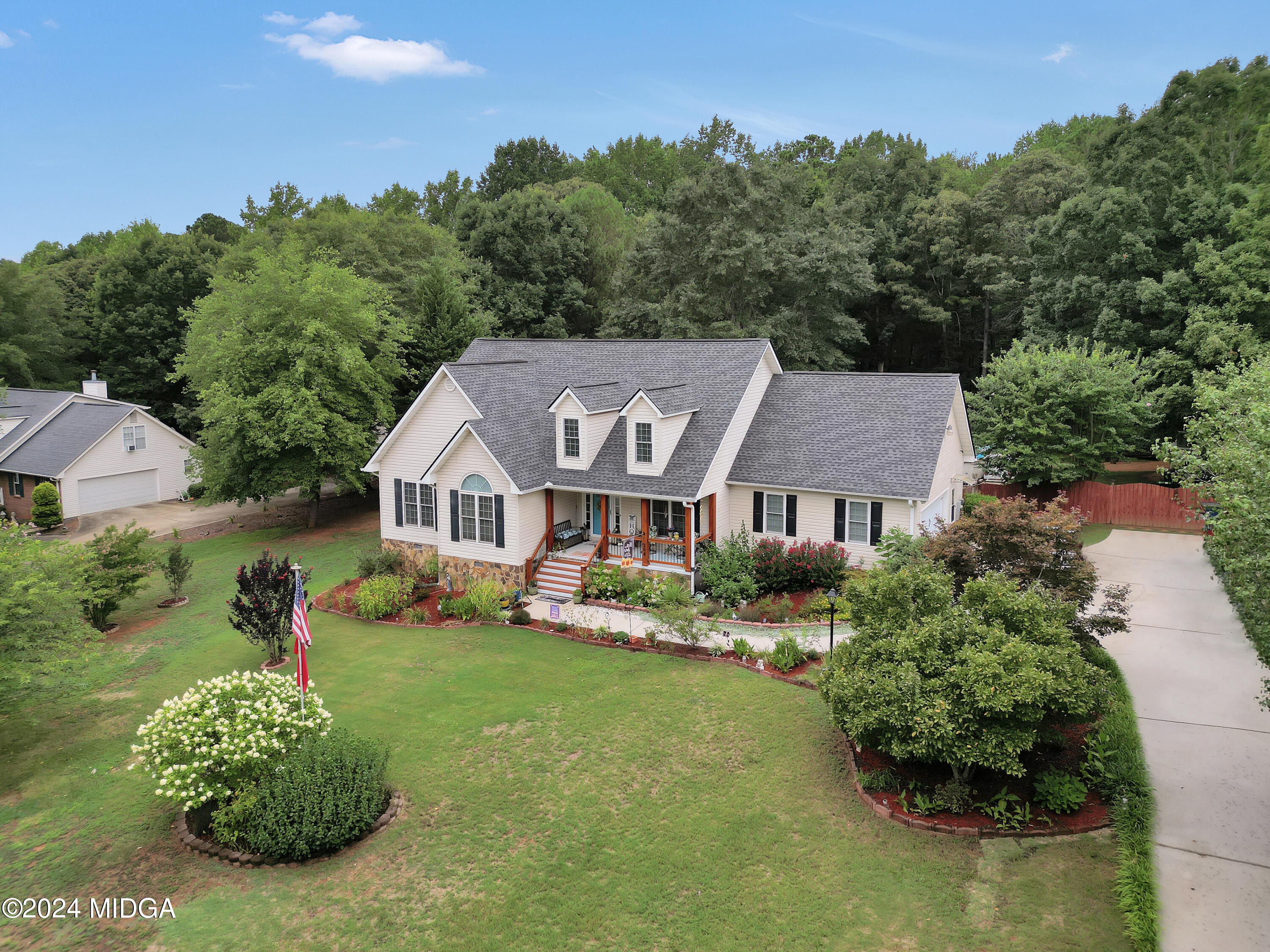 208 Brown Branch Road Locust Grove, GA 30248 - Photo 3 of 44 an aerial view of a house with yard and green space