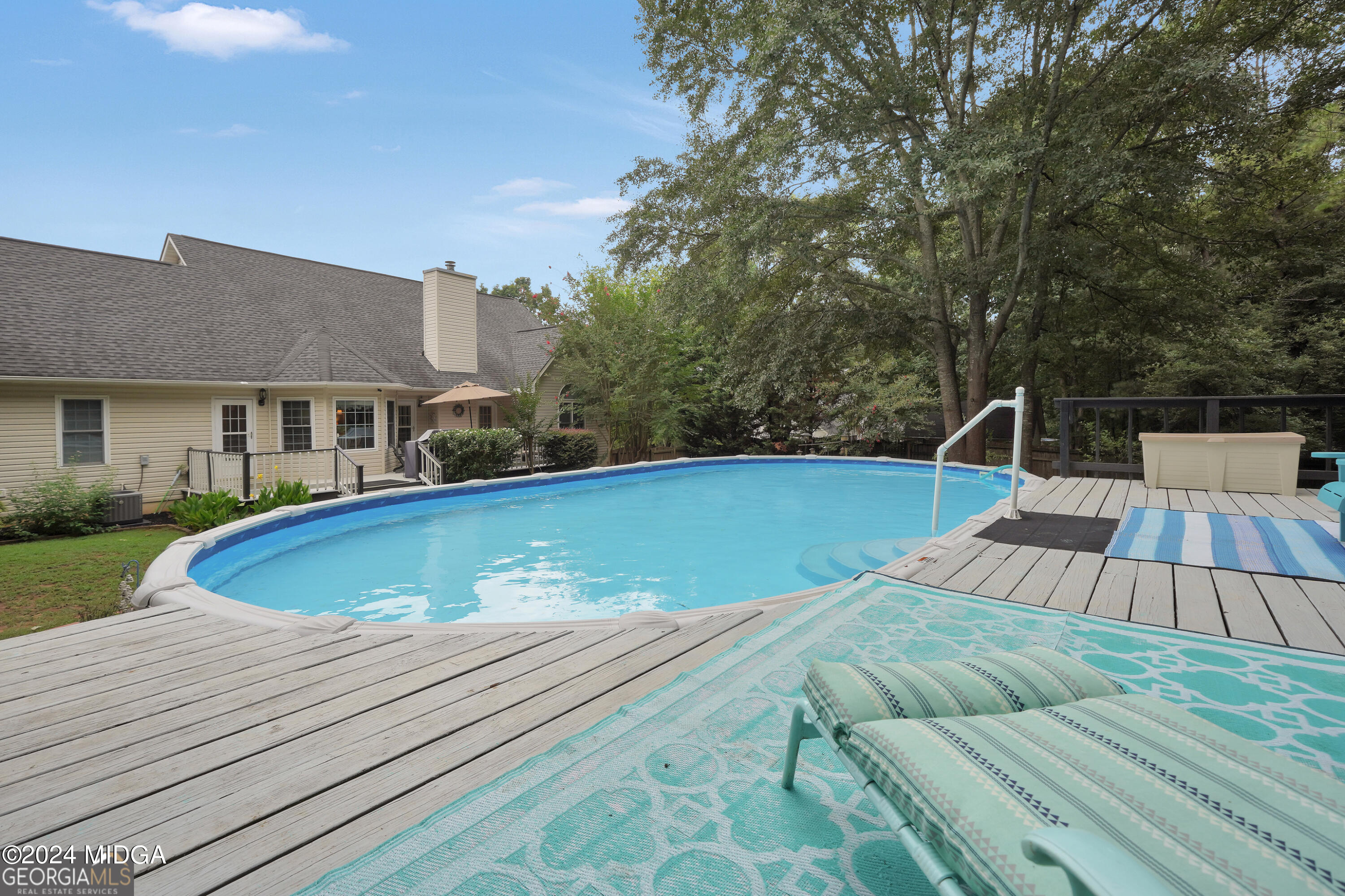 208 Brown Branch Road Locust Grove, GA 30248 - Photo 42 of 44 a view of swimming pool with seating space