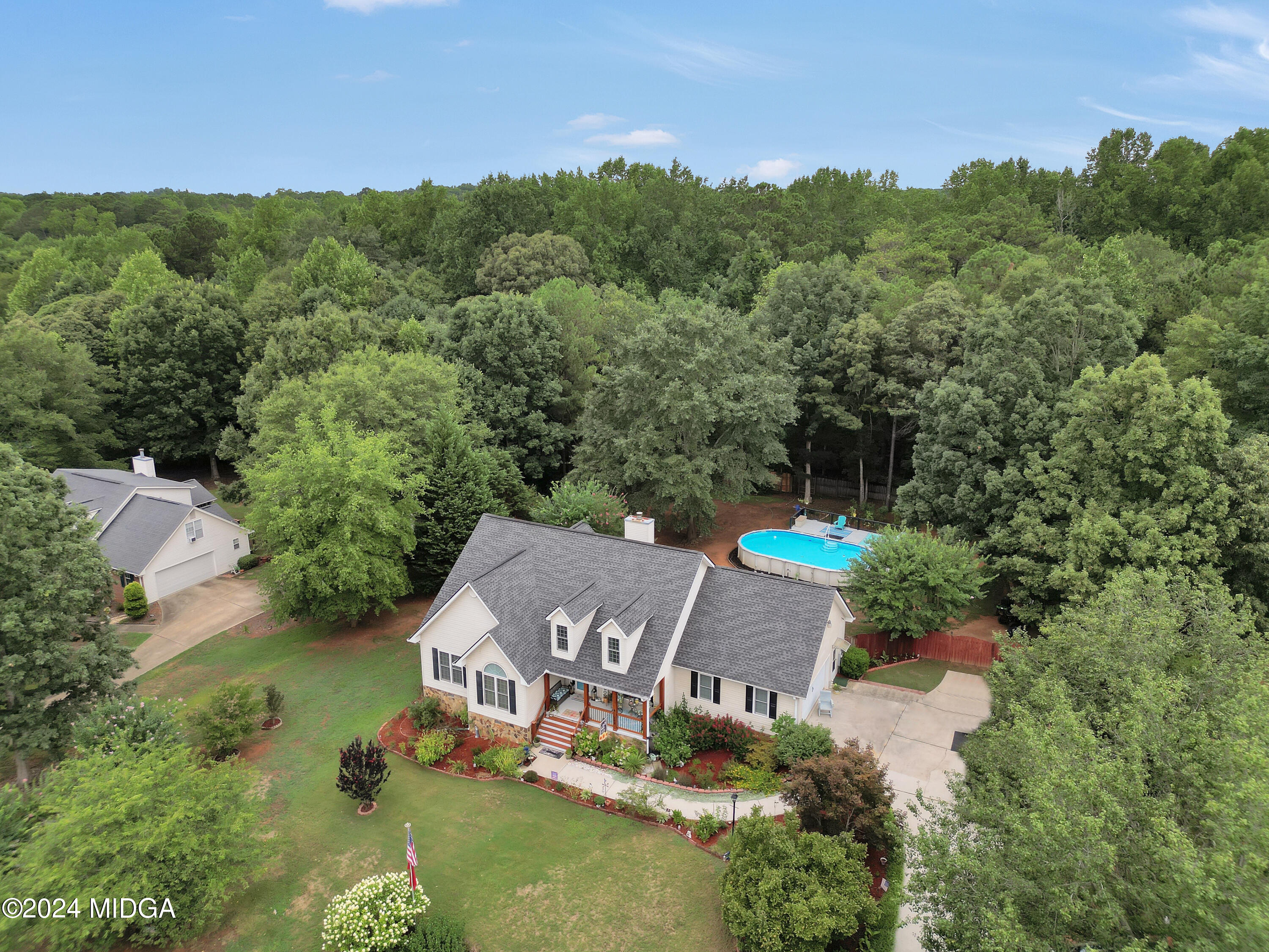 208 Brown Branch Road Locust Grove, GA 30248 - Photo 5 of 44 an aerial view of a house with a yard