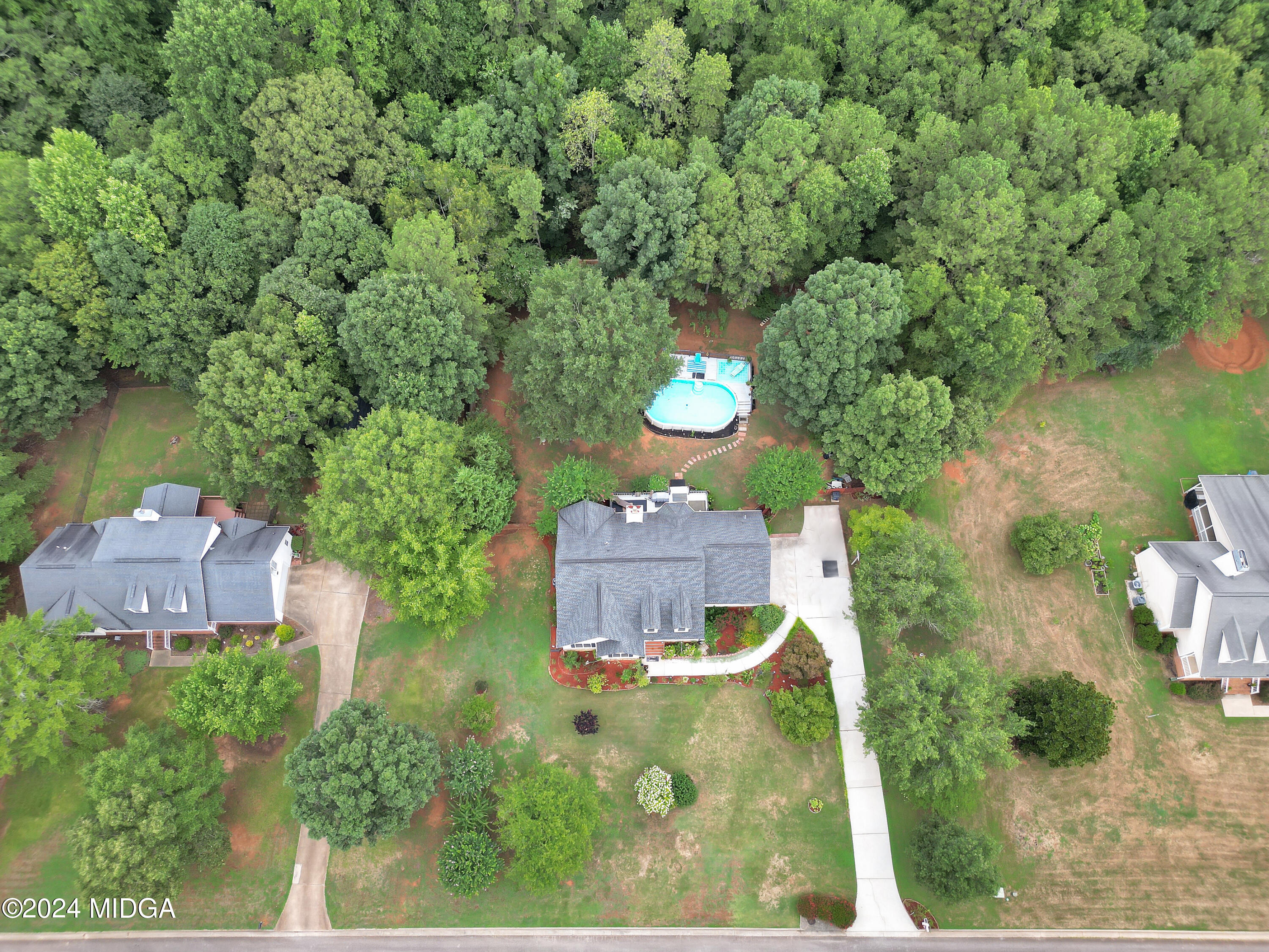 208 Brown Branch Road Locust Grove, GA 30248 - Photo 8 of 44 an aerial view of a house with a yard and lake view