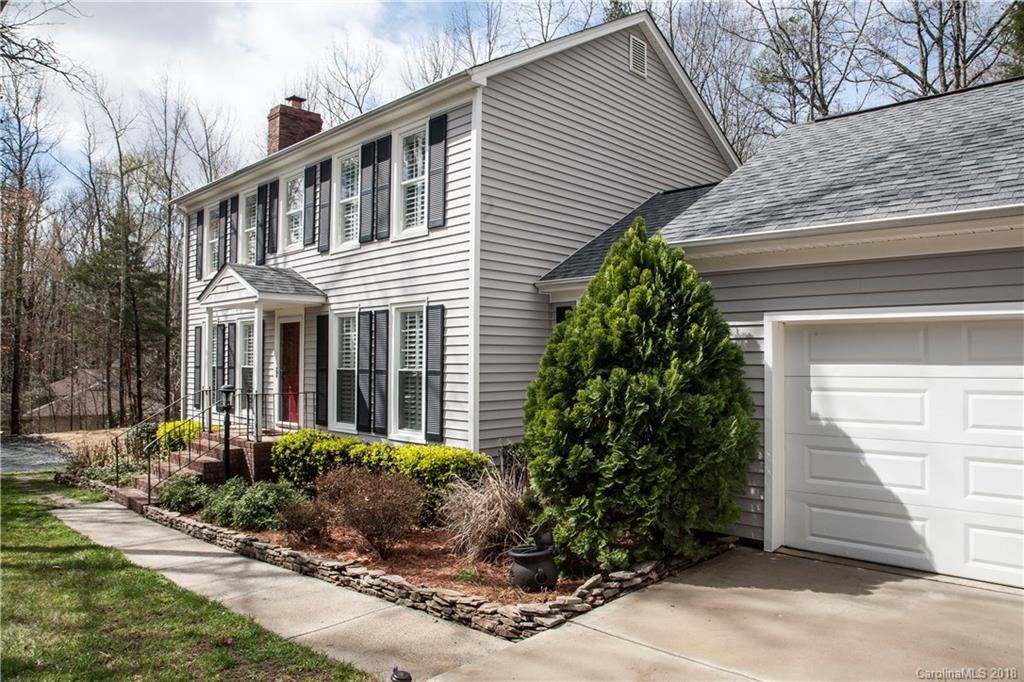 2751 Farmstead Lane, Unit 63 Fort Mill, SC 29708 - Photo 2 of 30 a front view of a house with garden