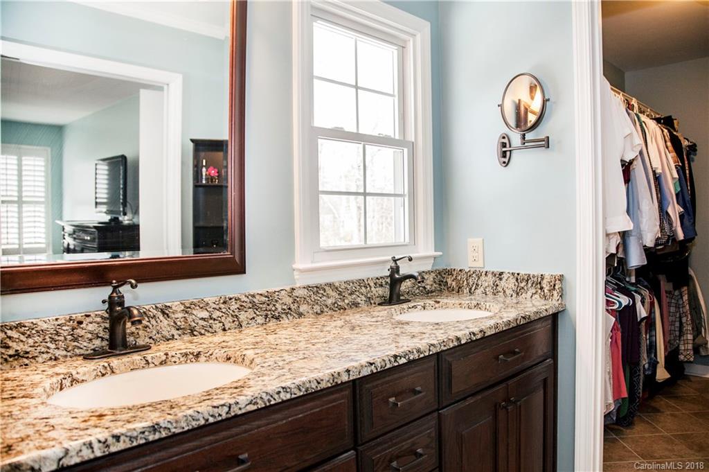 2751 Farmstead Lane, Unit 63 Fort Mill, SC 29708 - Photo 14 of 30 a bathroom with a granite countertop sink and a window