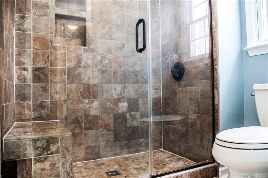 2751 Farmstead Lane, Unit 63 Fort Mill, SC 29708 - Photo 15 of 30 a bathroom with a shower and toilet