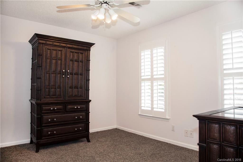 2751 Farmstead Lane, Unit 63 Fort Mill, SC 29708 - Photo 17 of 30 an entryway with a window and a dresser