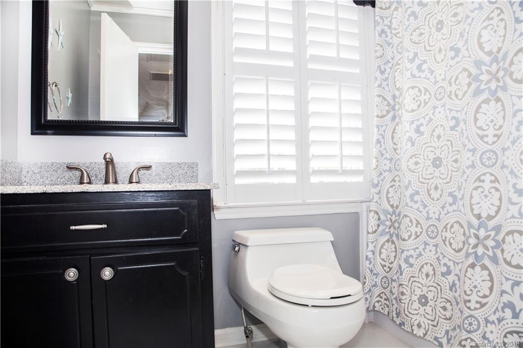 2751 Farmstead Lane, Unit 63 Fort Mill, SC 29708 - Photo 18 of 30 a bathroom with a toilet a sink and a window