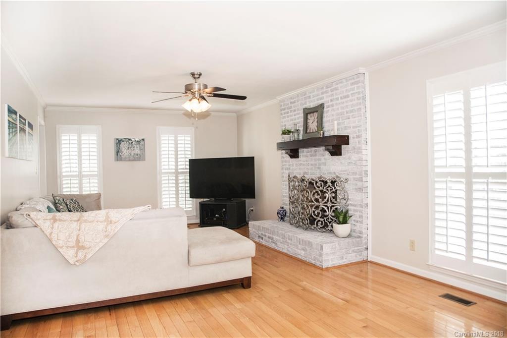 2751 Farmstead Lane, Unit 63 Fort Mill, SC 29708 - Photo 5 of 30 a living room with furniture and a flat screen tv