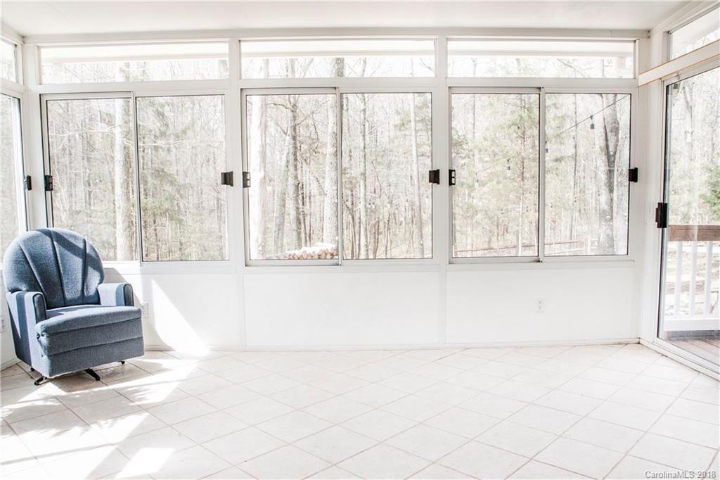 2751 Farmstead Lane, Unit 63 Fort Mill, SC 29708 - Photo 7 of 30 a living room with a large window and a couch