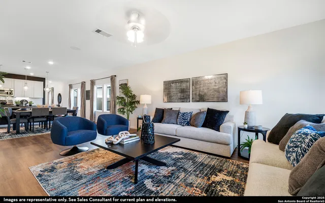 a living room with furniture or couch and a table