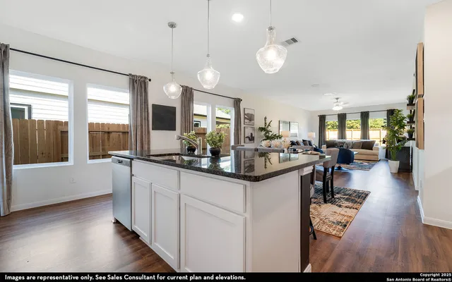 a view of living room and kitchen with furniture