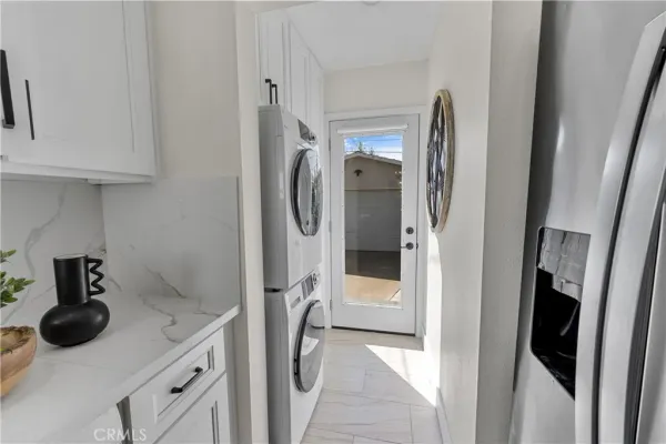 a kitchen with stainless steel appliances granite countertop a stove and a refrigerator