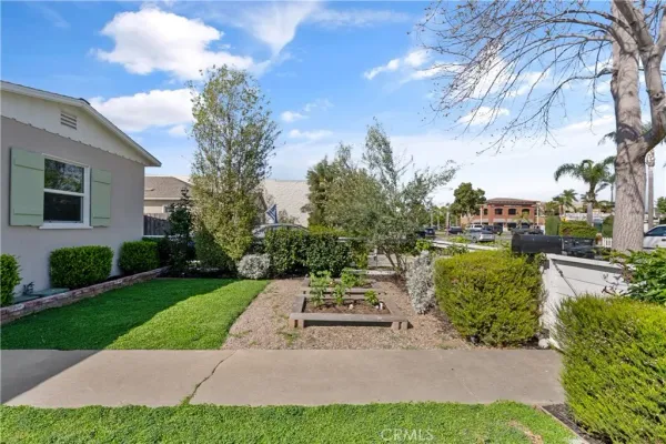 a view of a patio with table and chairs and potted plants