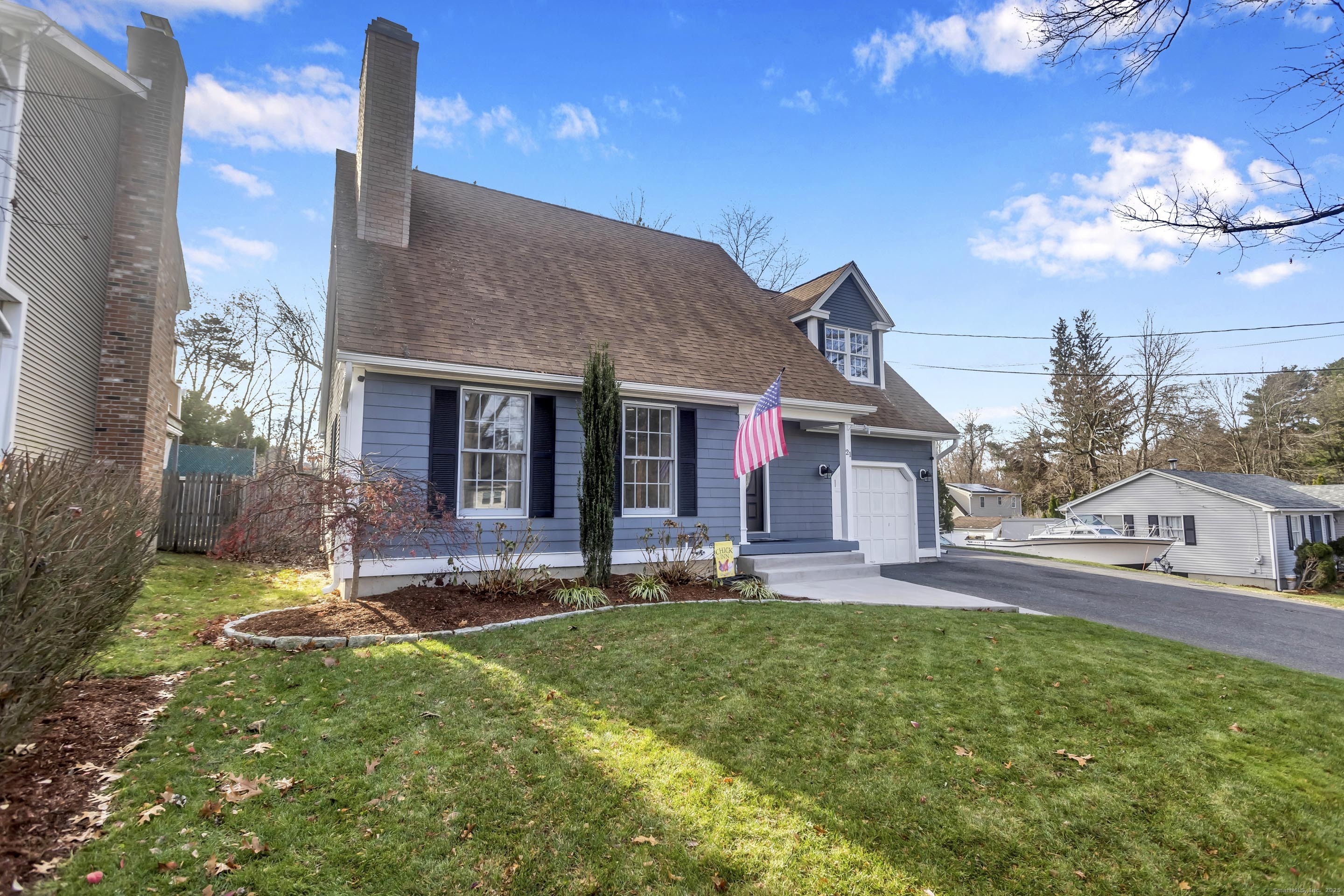 21 Brentwood Street Springfield, MA 01108 - Photo 1 of 40 a view of a house with a yard porch and sitting area