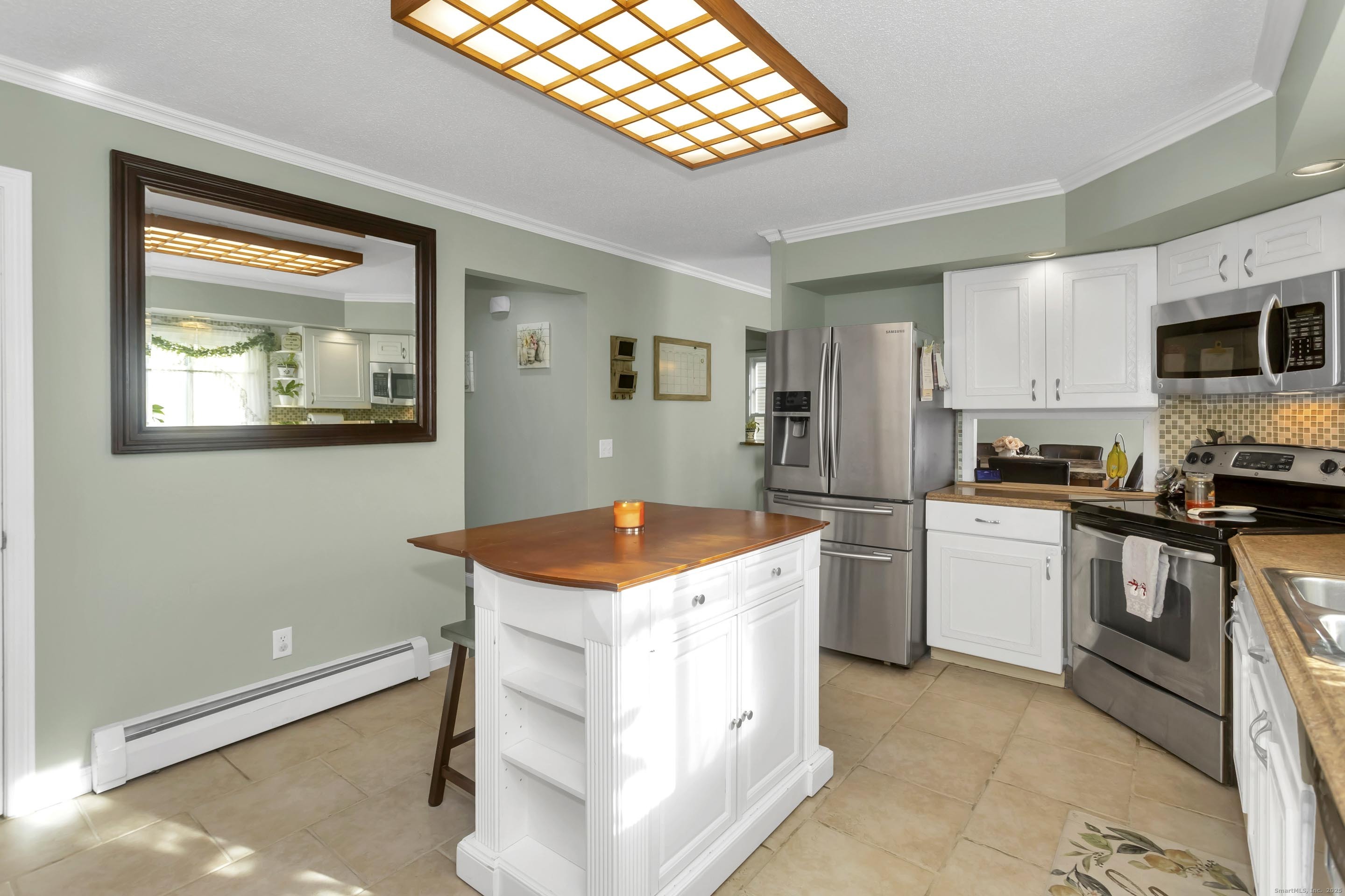 21 Brentwood Street Springfield, MA 01108 - Photo 13 of 40 a kitchen with stainless steel appliances granite countertop a stove a sink and a refrigerator