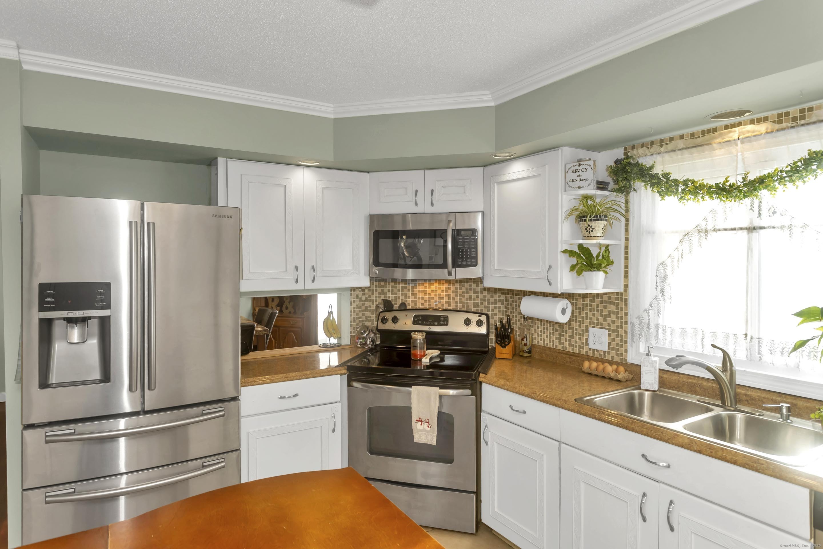 21 Brentwood Street Springfield, MA 01108 - Photo 14 of 40 a kitchen with a refrigerator stove and sink