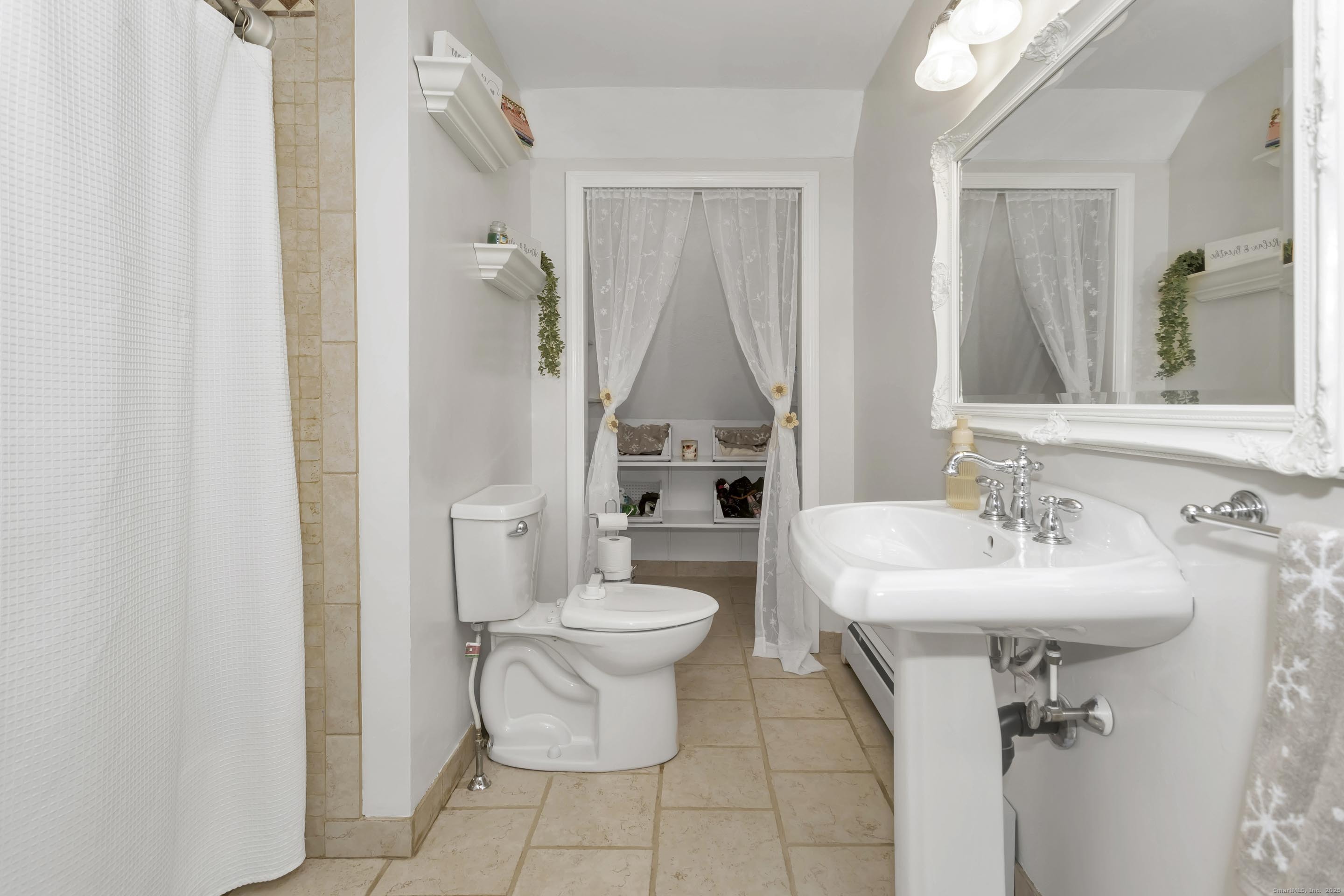 21 Brentwood Street Springfield, MA 01108 - Photo 25 of 40 a bathroom with a sink toilet and shower