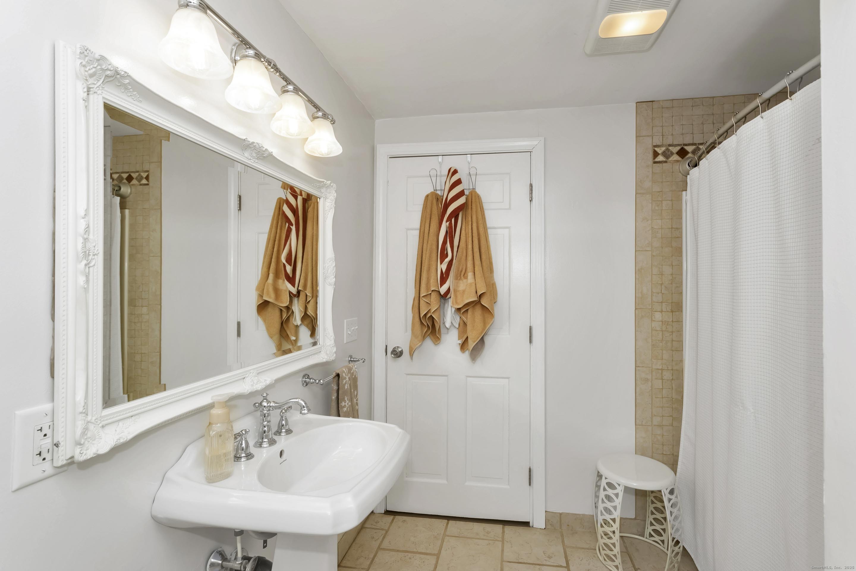 21 Brentwood Street Springfield, MA 01108 - Photo 26 of 40 a bathroom with a sink and a mirror