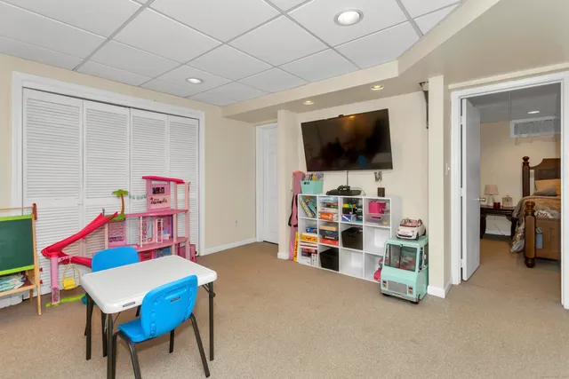 a room with furniture and a flat screen tv