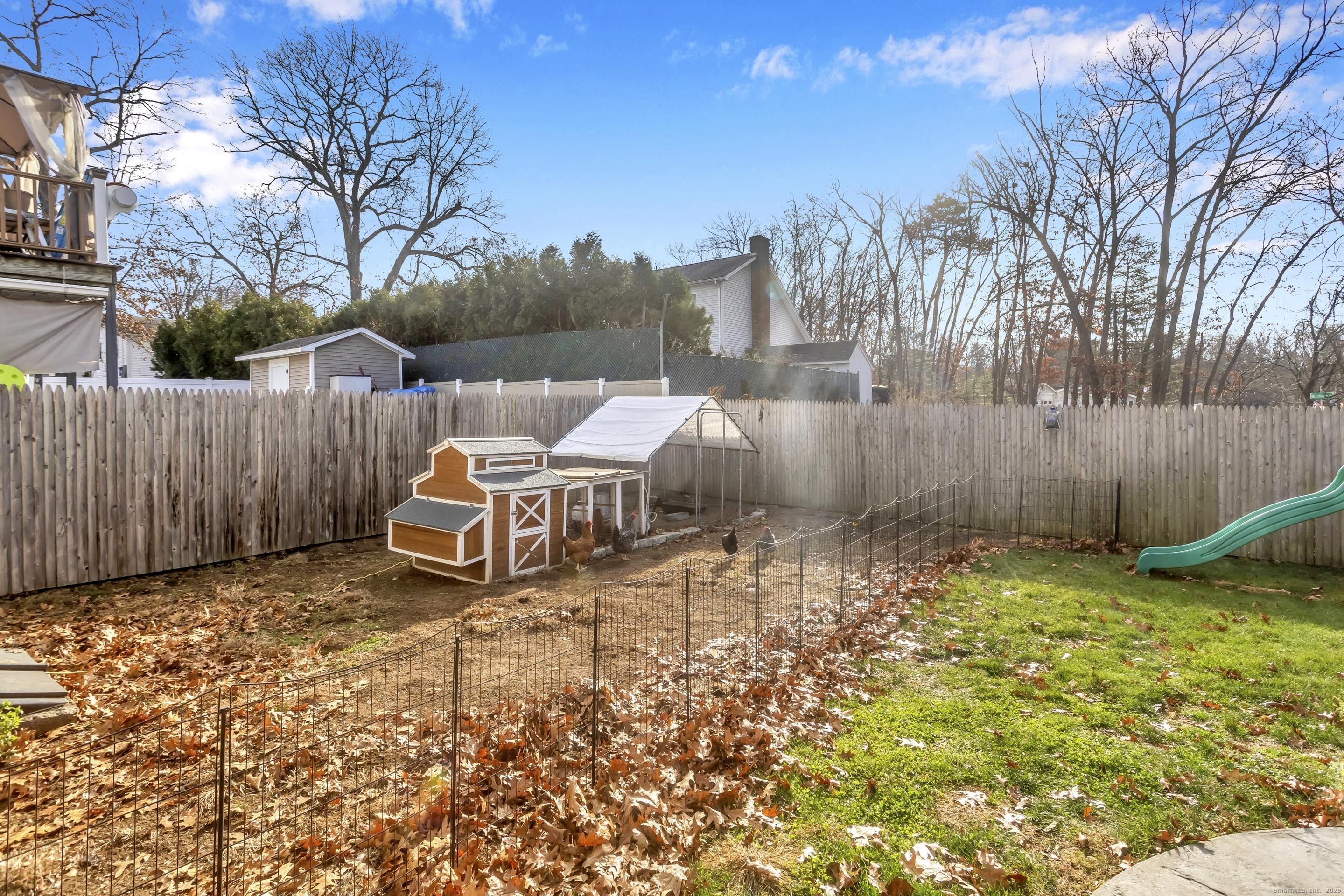 21 Brentwood Street Springfield, MA 01108 - Photo 35 of 40 a backyard of a house with lots of green space