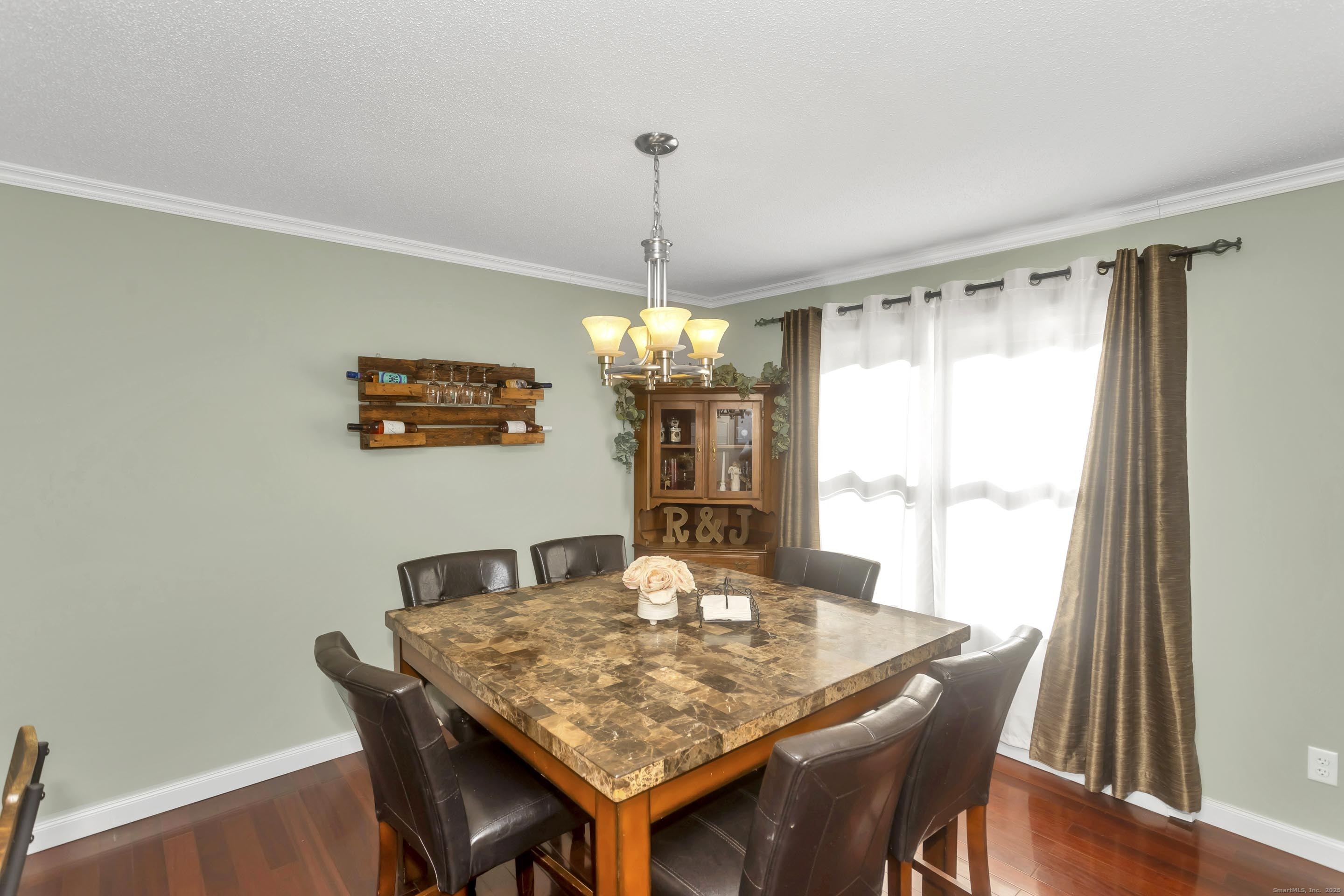 21 Brentwood Street Springfield, MA 01108 - Photo 8 of 40 a view of a dining room with furniture window and wooden floor