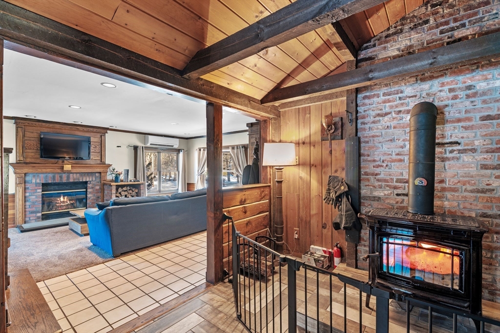 88 Squannacook Road Shirley, MA 01464 - Photo 14 of 39 a view of a kitchen with furniture and flat screen tv