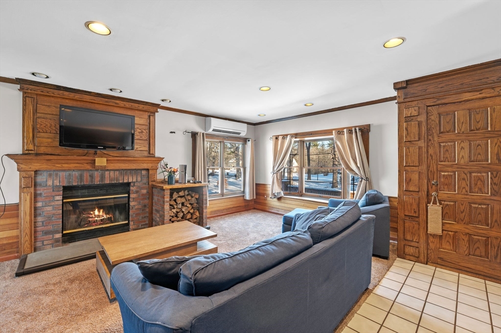 88 Squannacook Road Shirley, MA 01464 - Photo 18 of 39 a living room with furniture fireplace and flat screen tv