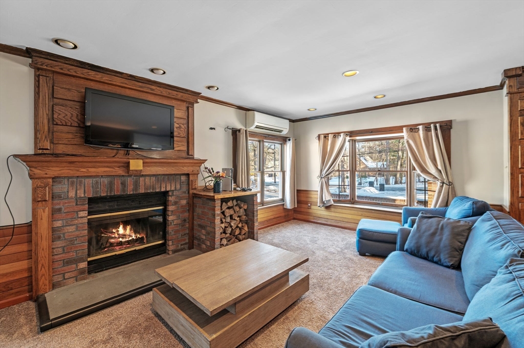 88 Squannacook Road Shirley, MA 01464 - Photo 19 of 39 a living room with furniture and a fireplace