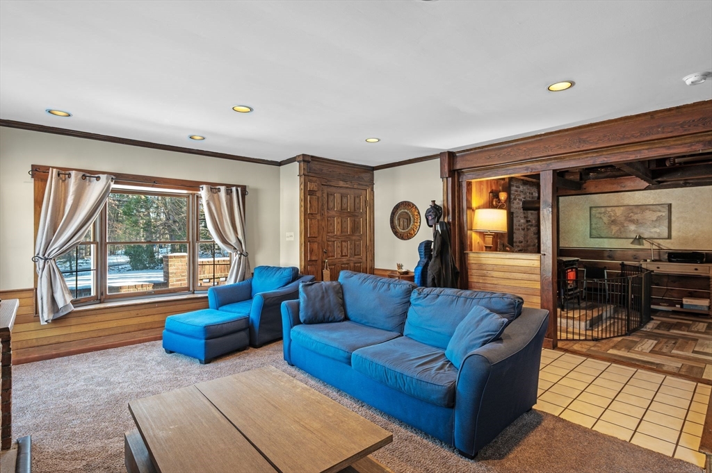 88 Squannacook Road Shirley, MA 01464 - Photo 23 of 39 a living room with furniture and a flat screen tv