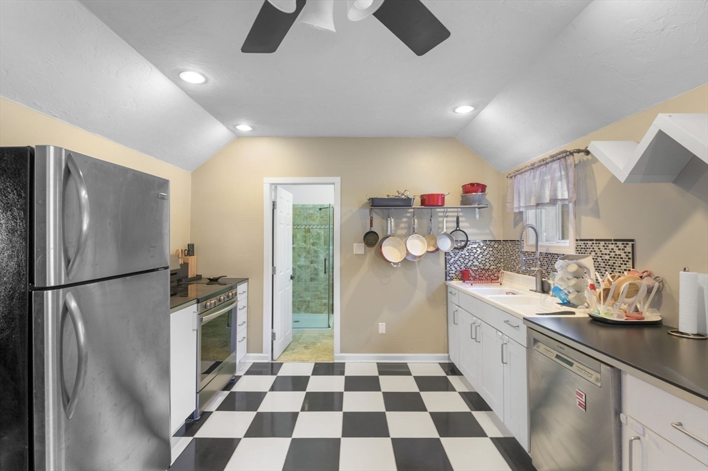 88 Squannacook Road Shirley, MA 01464 - Photo 27 of 39 a kitchen with a refrigerator and a sink