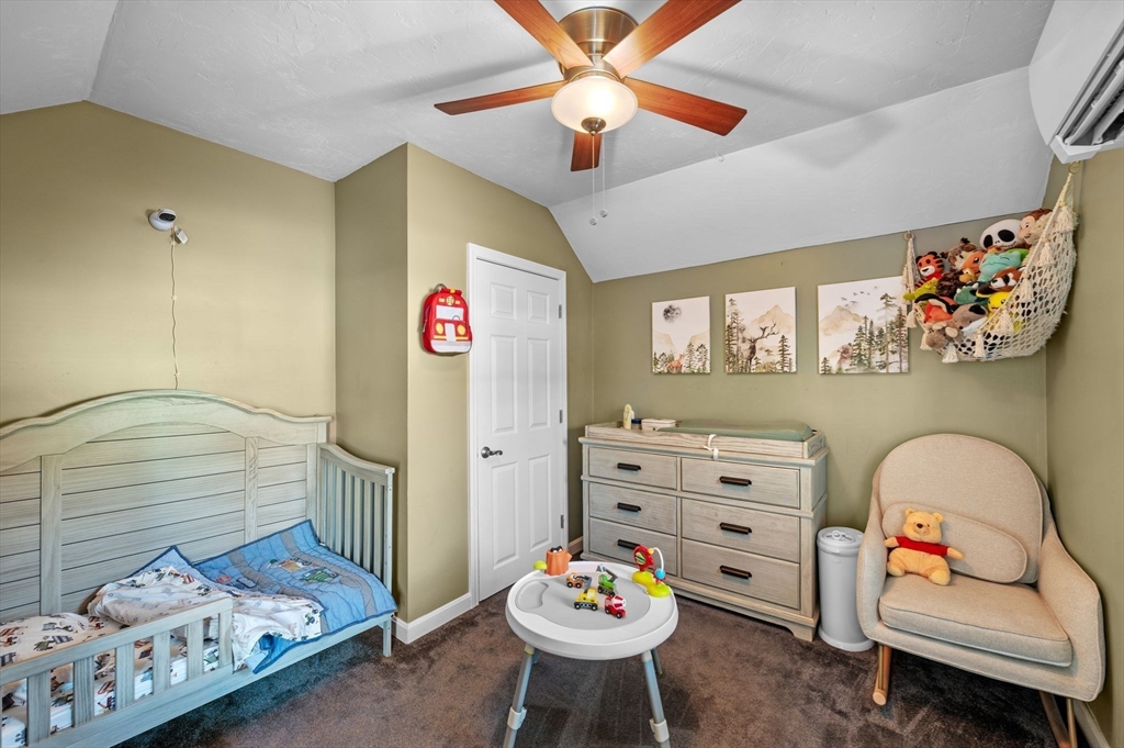 88 Squannacook Road Shirley, MA 01464 - Photo 33 of 39 a bedroom with furniture and a chair