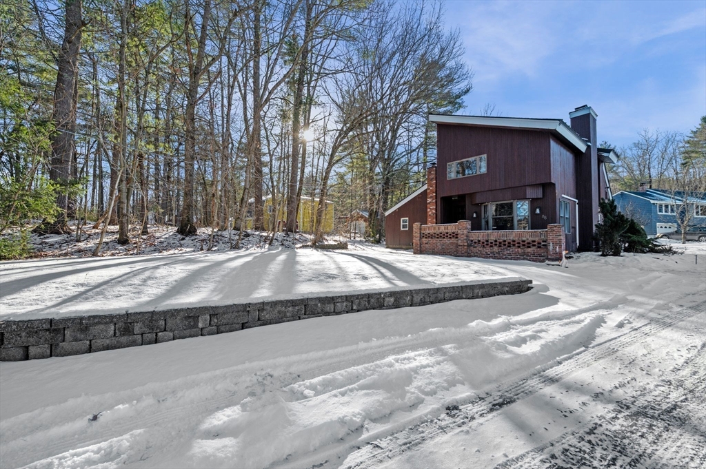 88 Squannacook Road Shirley, MA 01464 - Photo 4 of 39 a tall building with trees in front of it
