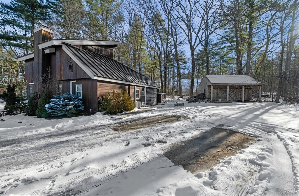 88 Squannacook Road Shirley, MA 01464 - Photo 7 of 39 a front view of a house with a yard