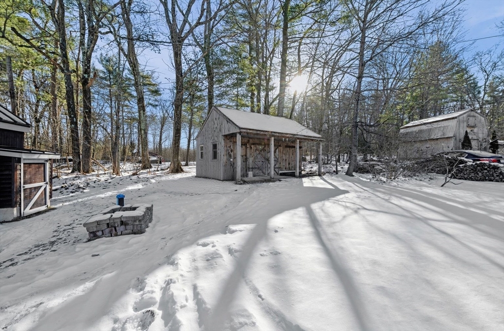 88 Squannacook Road Shirley, MA 01464 - Photo 8 of 39 a swimming pool with outdoor seating and trees