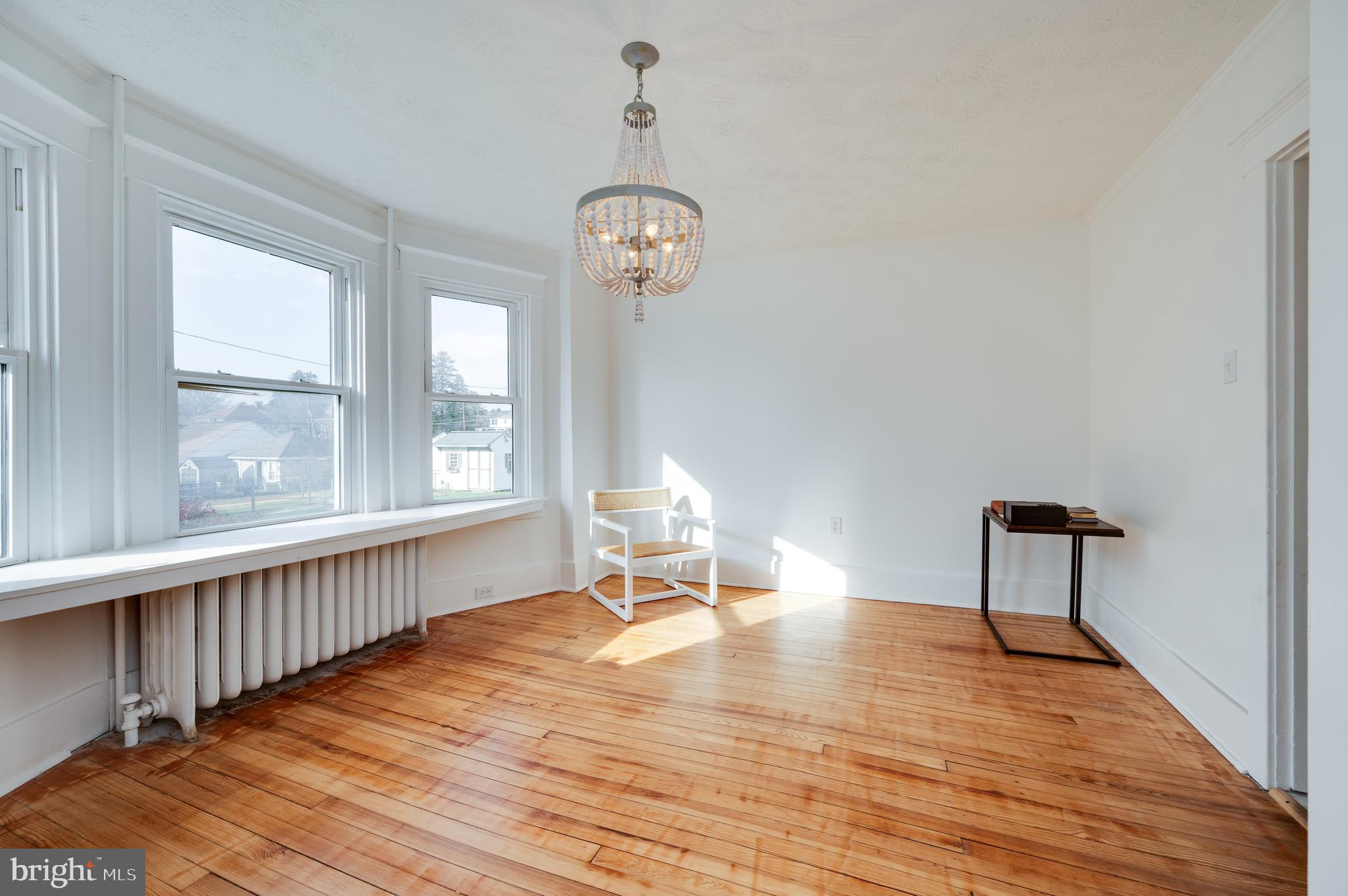 2021 Noble Street Reading, PA 19609 - Photo 13 of 54 wooden floor in a hall with a window