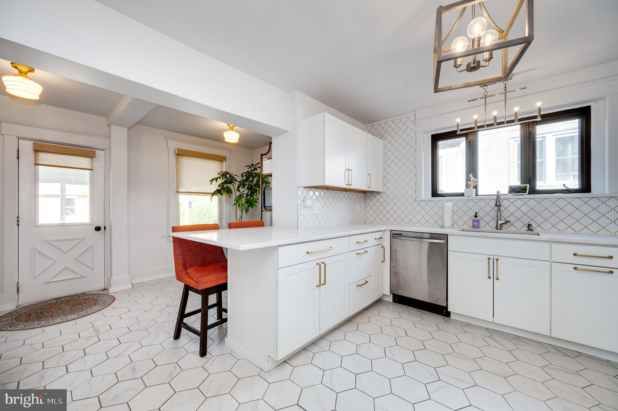 2021 Noble Street Reading, PA 19609 - Photo 18 of 54 a kitchen with sink cabinets and window