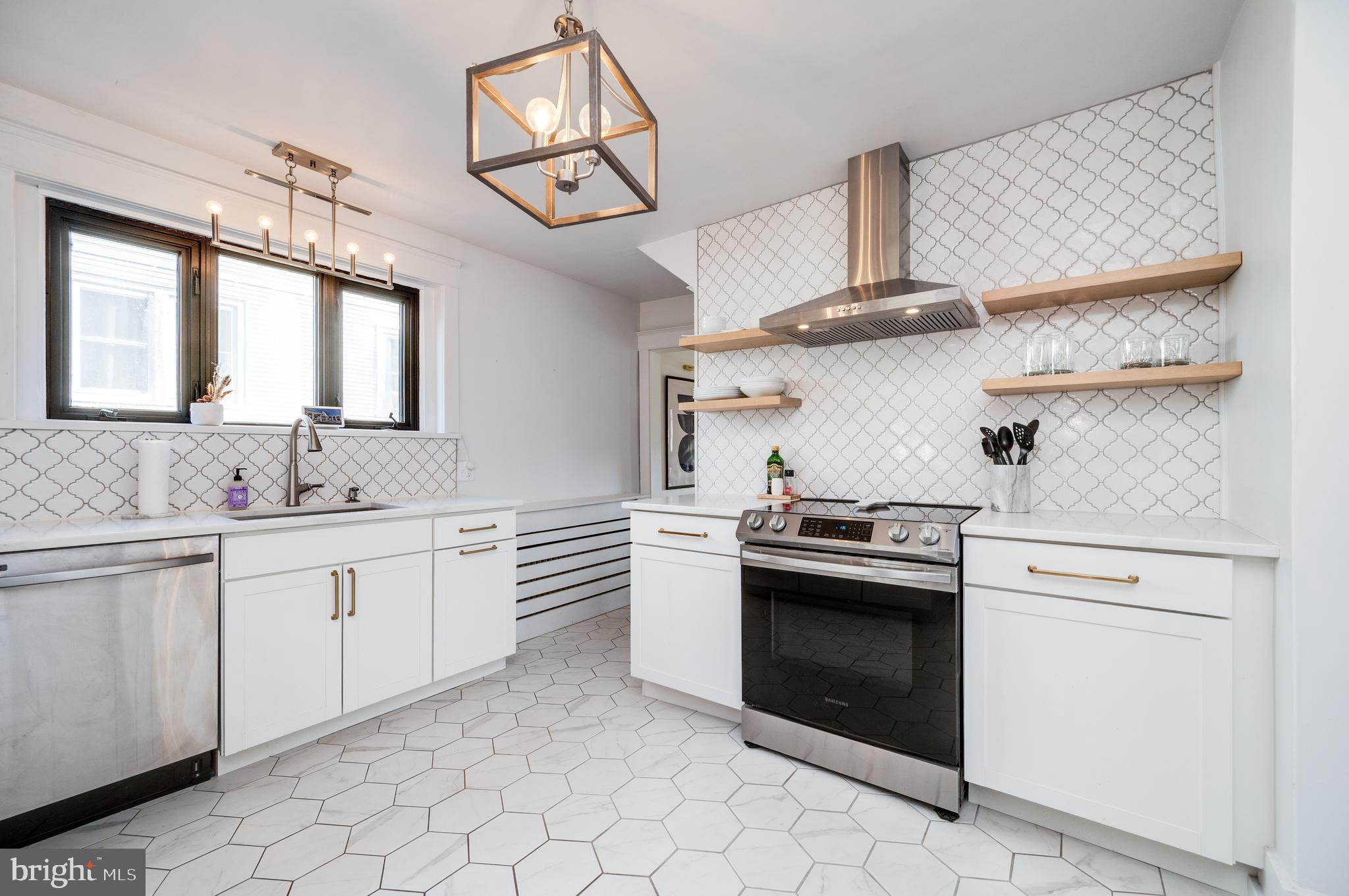 2021 Noble Street Reading, PA 19609 - Photo 20 of 54 a kitchen with cabinets appliances and a sink