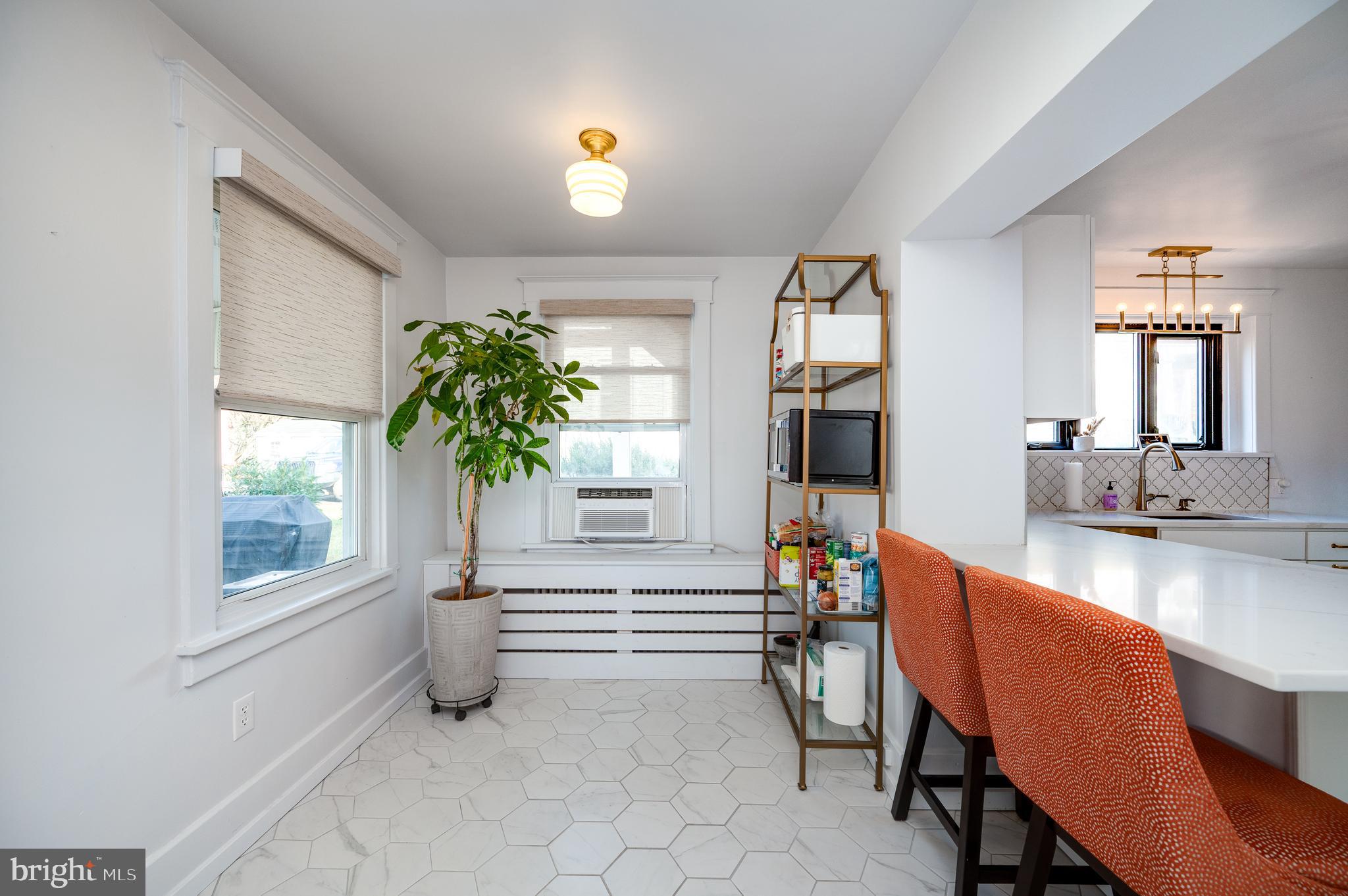 2021 Noble Street Reading, PA 19609 - Photo 24 of 54 a living room with furniture and a potted plant
