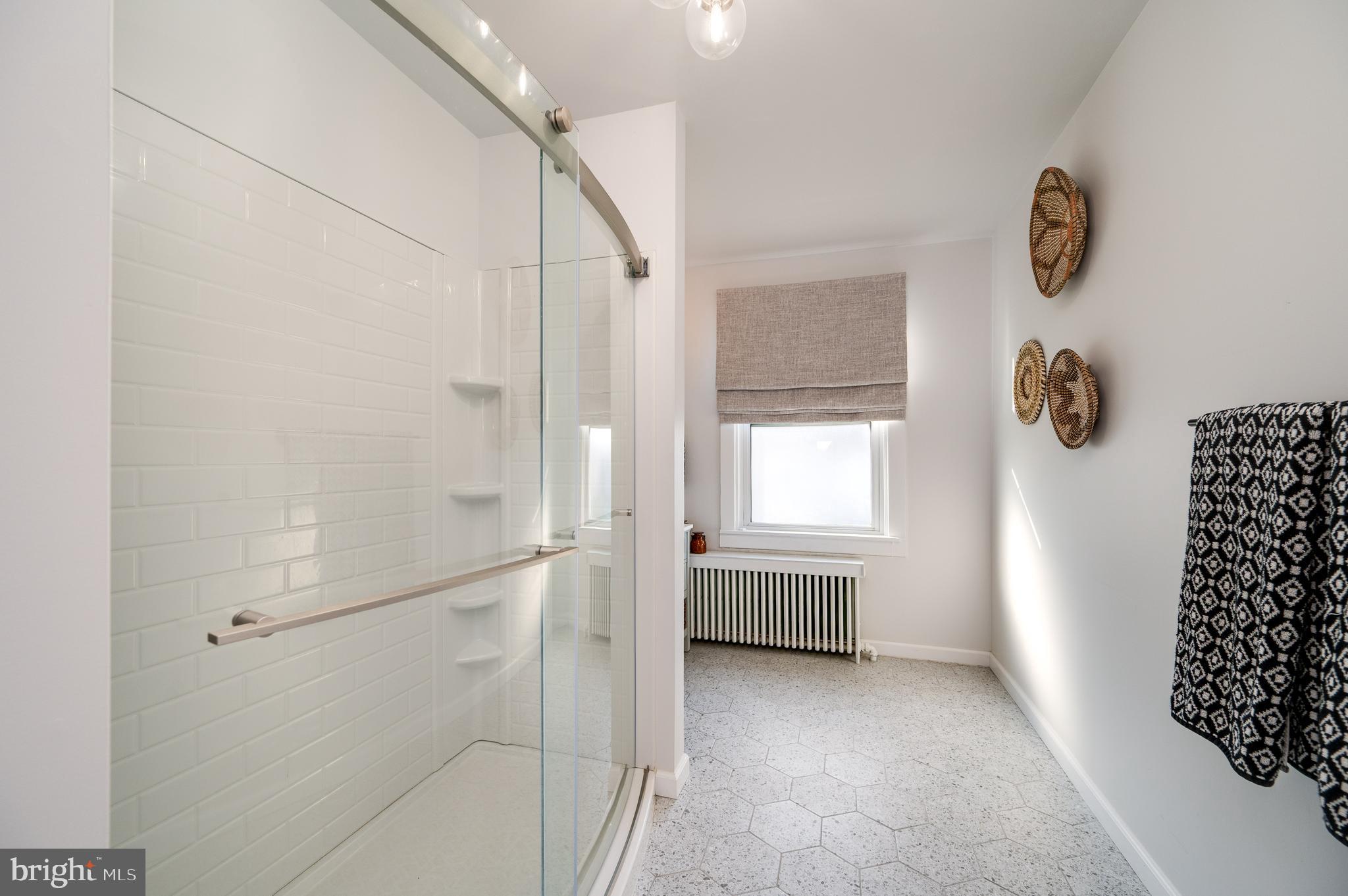2021 Noble Street Reading, PA 19609 - Photo 25 of 54 a bathroom with a shower and a window