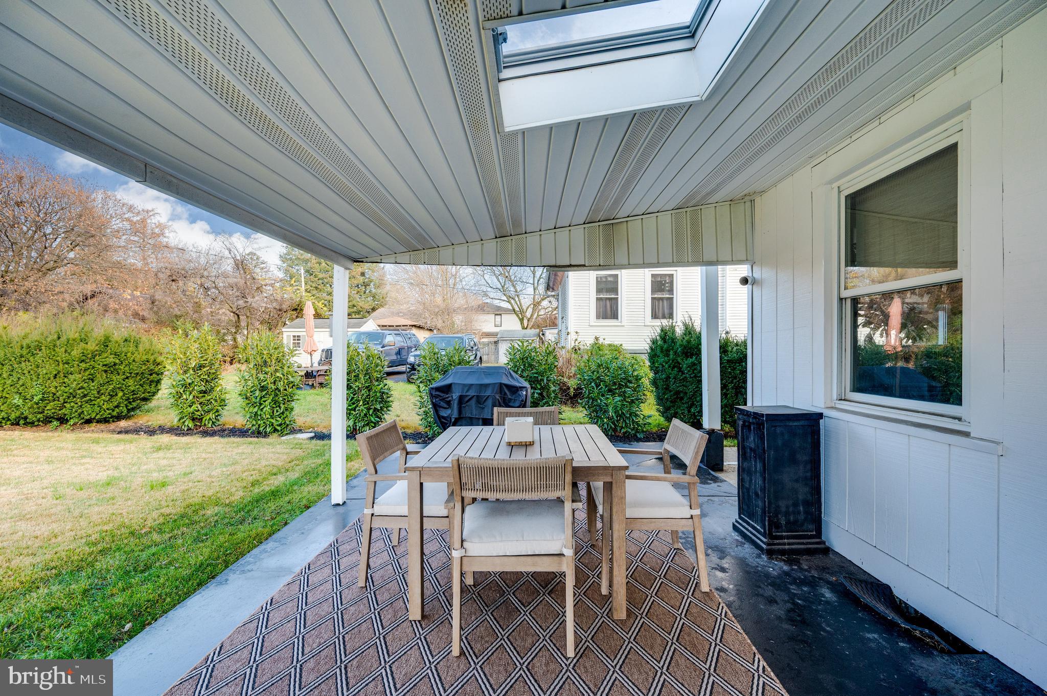 2021 Noble Street Reading, PA 19609 - Photo 51 of 54 a patio with table and chairs and potted plants with wooden floor